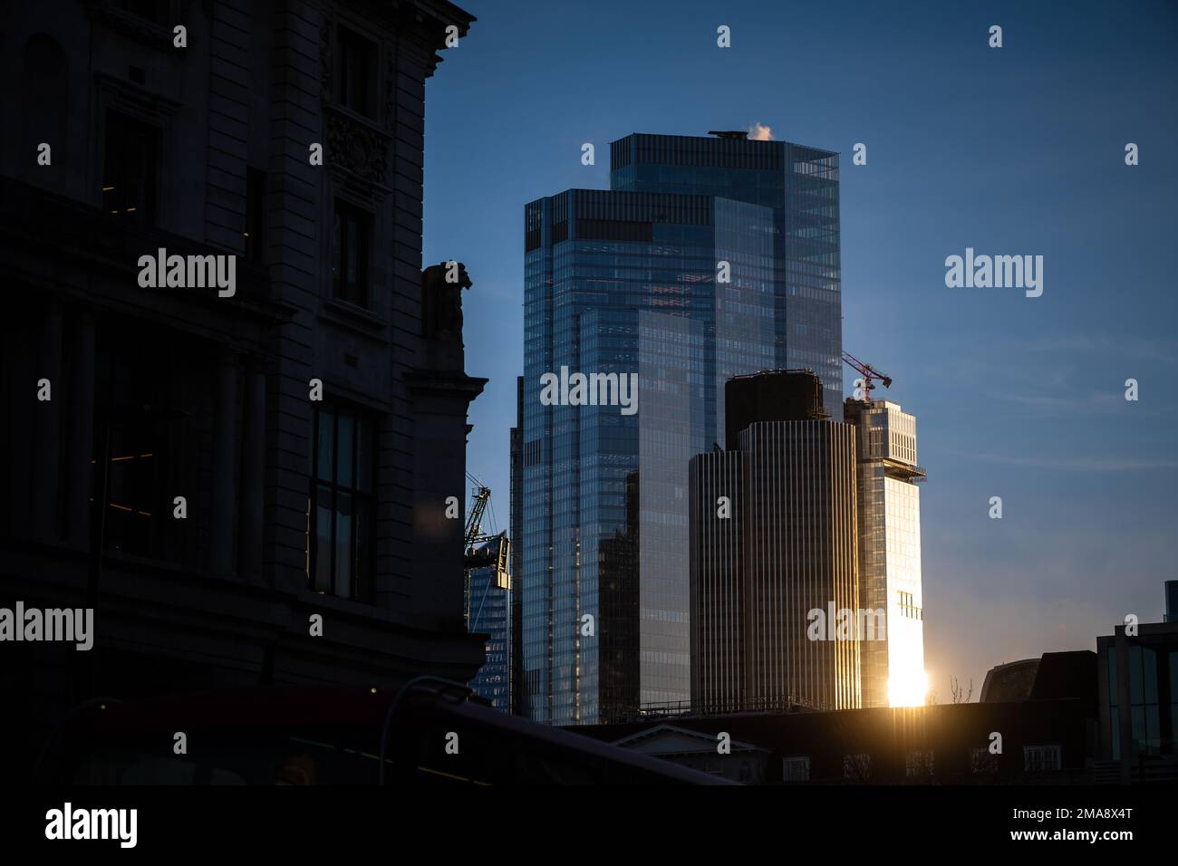 Winter evening sunlight shines on office buildings in London Stock Photo