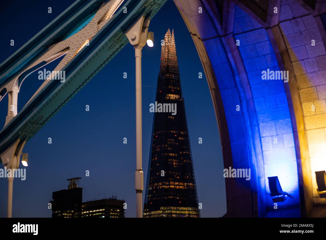 The Shard at night seen from Tower Bridge in London Stock Photo