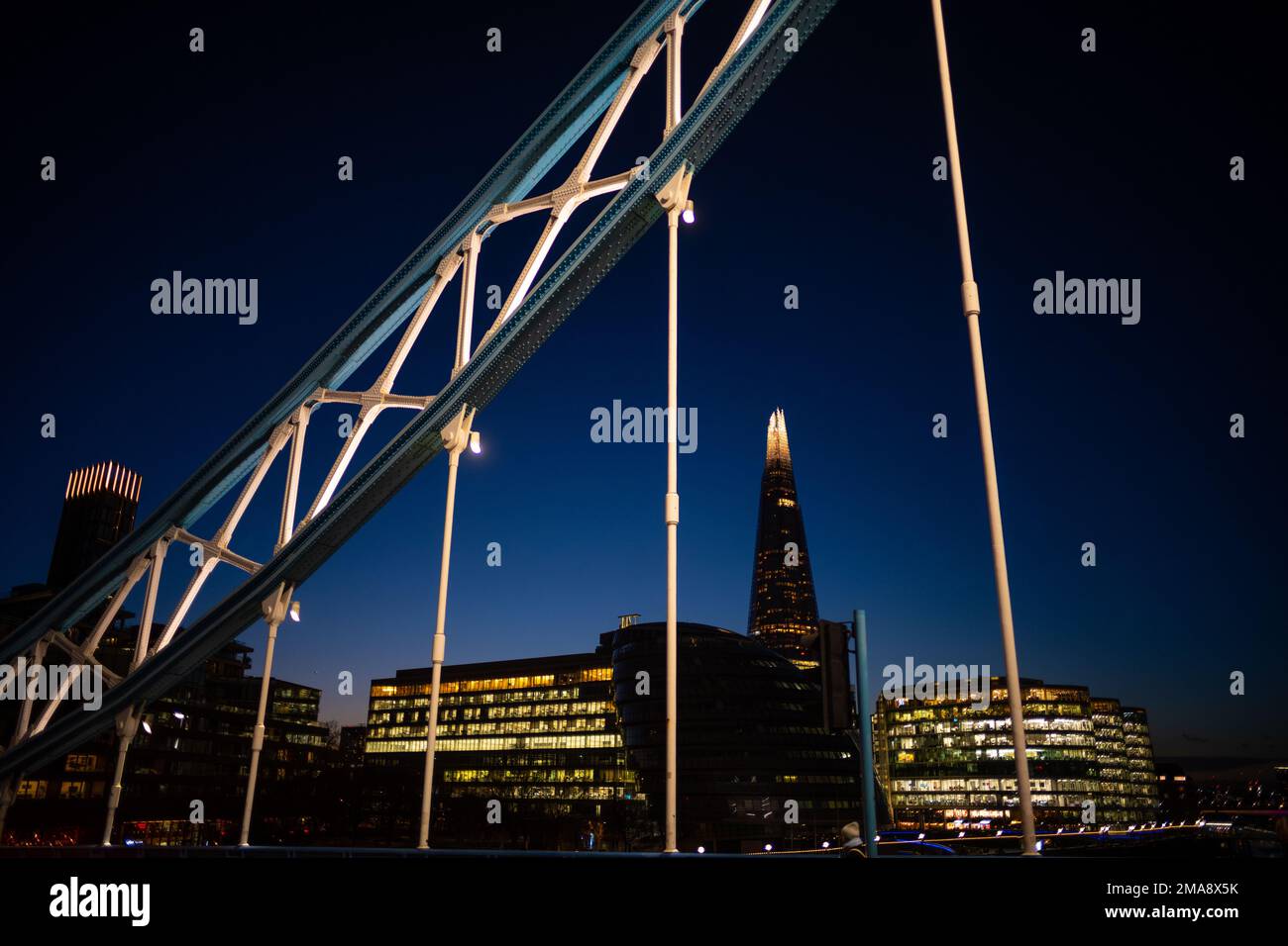 The Shard at night seen from Tower Bridge in London Stock Photo