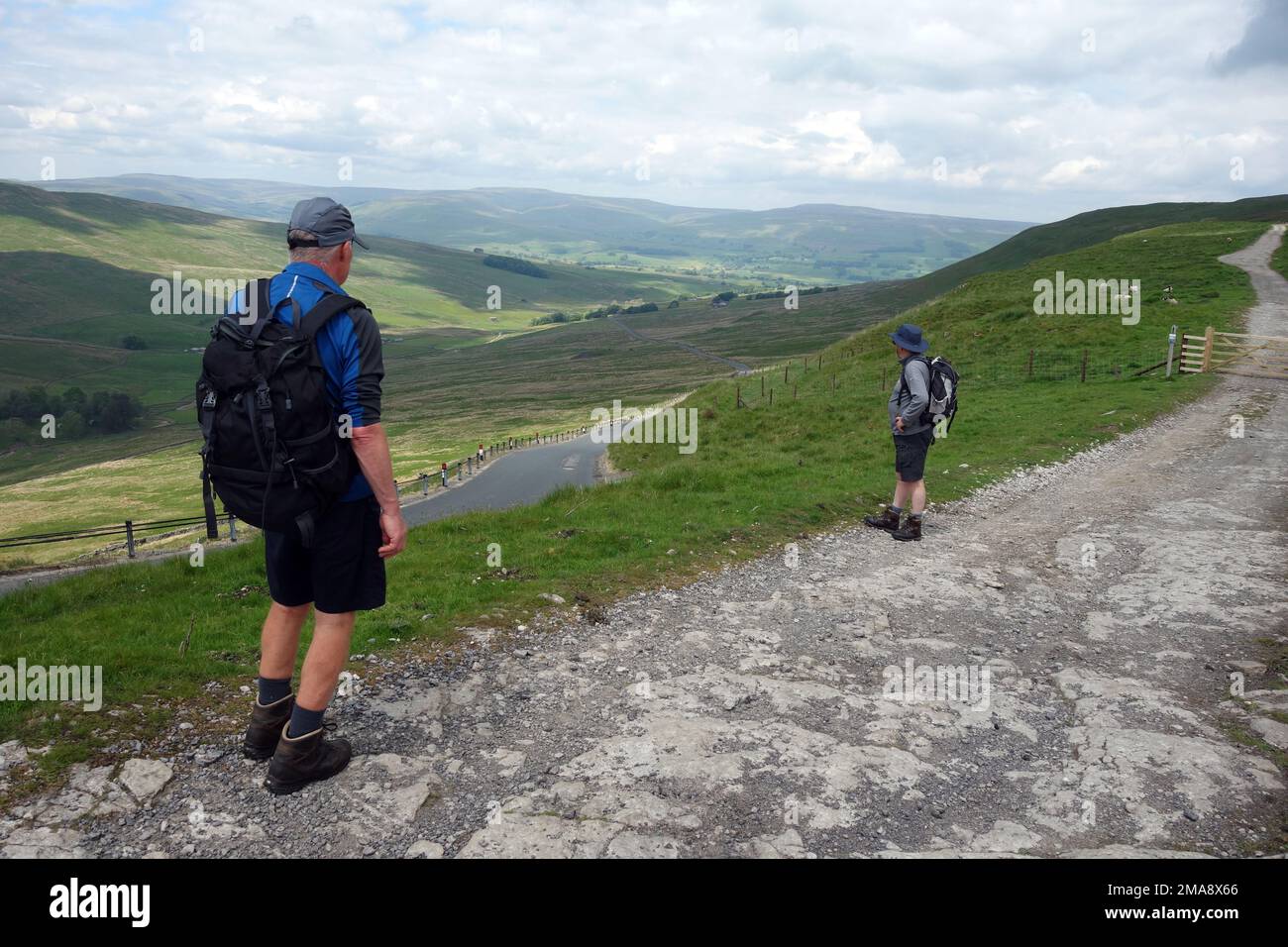 Two Men Standing near the Hawes to Kettlewell Road on the Cam High Road (Roman Road) in Wensleydale, Yorkshire Dales National Park, England' UK. Stock Photo