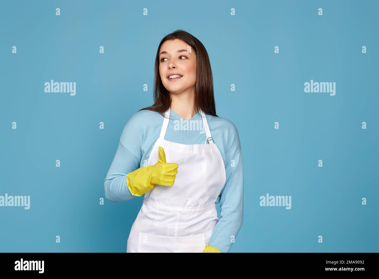 woman in rubber gloves and cleaner apron showing ok sign Stock Photo ...
