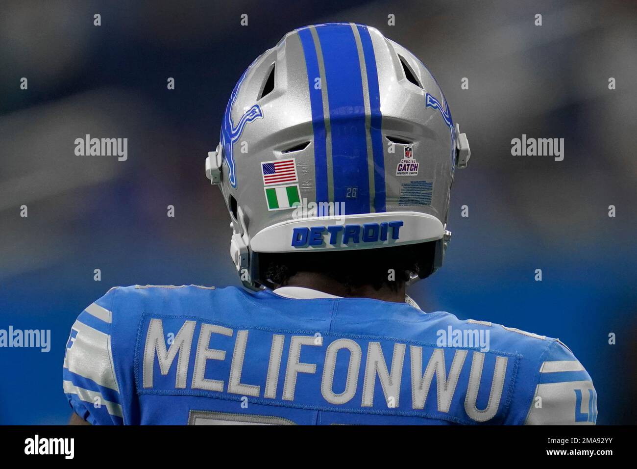 Detroit Lions cornerback Ifeatu Melifonwu (26) wears the flag of