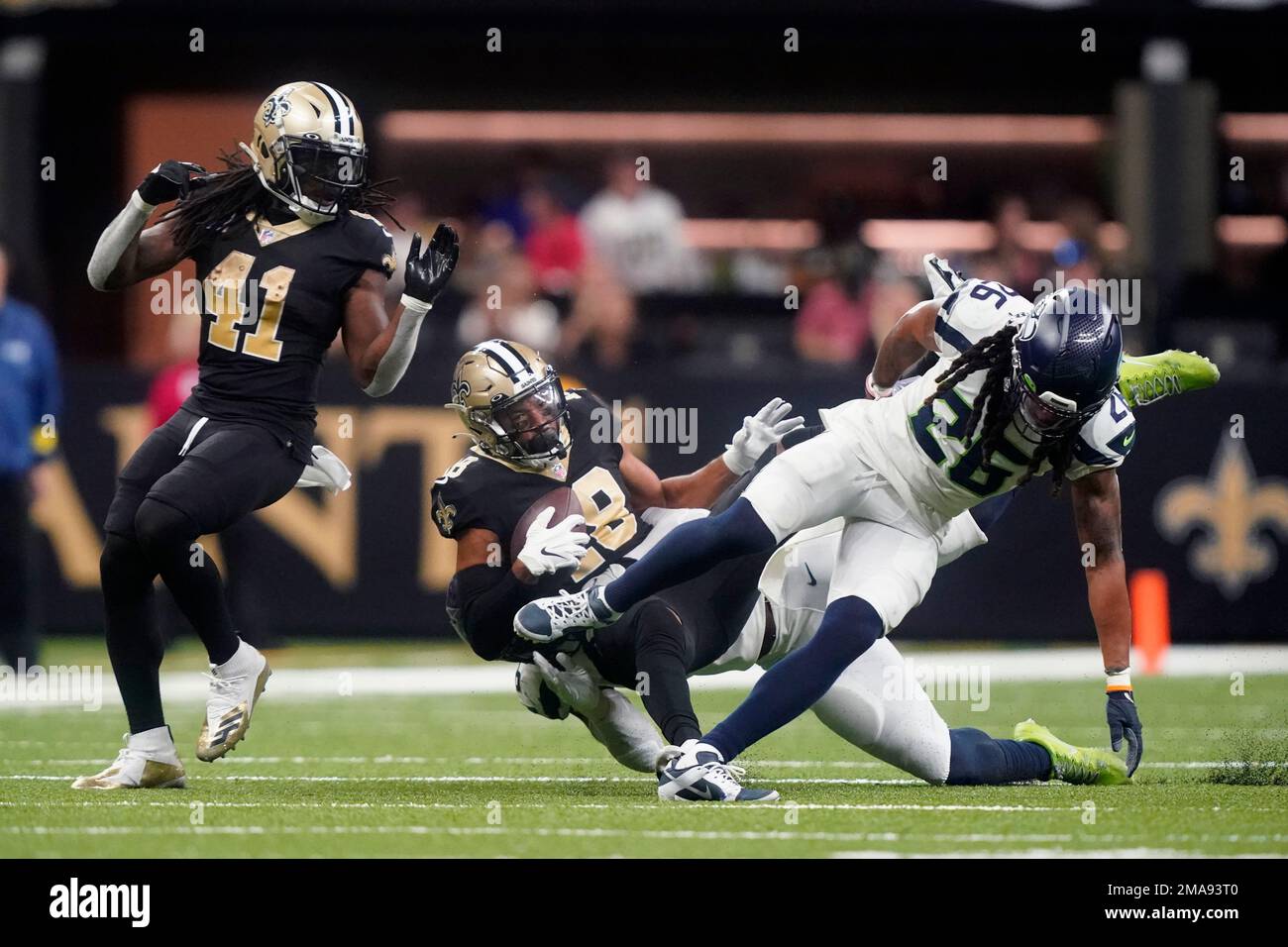 New Orleans Saints wide receiver Keith Kirkwood (18) is brought down by  Seattle Seahawks safety Ryan Neal (26) in the second half of an NFL  football game in New Orleans, Sunday, Oct.