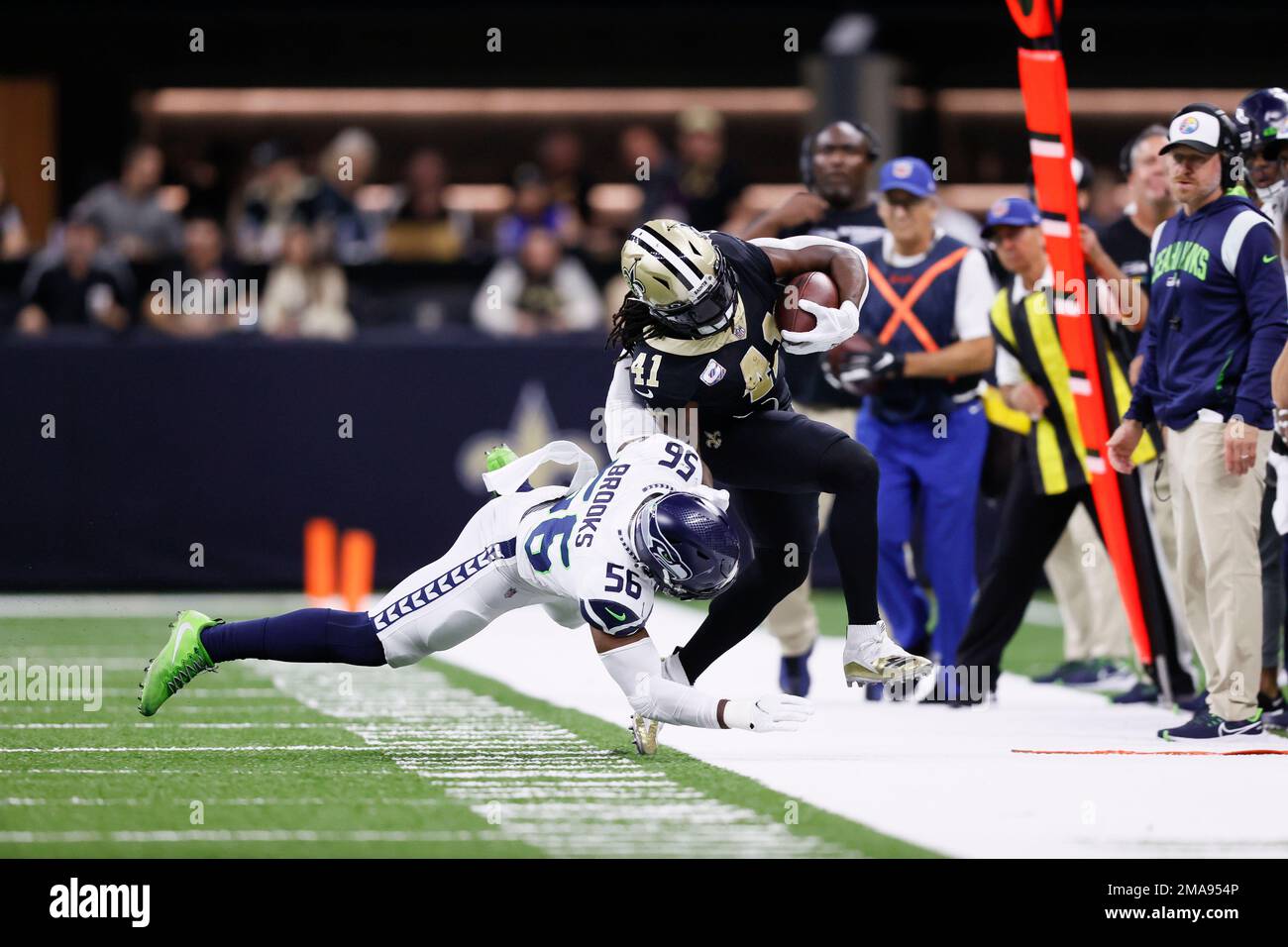 Seattle Seahawks linebacker Jordyn Brooks (56) tackles New Orleans
