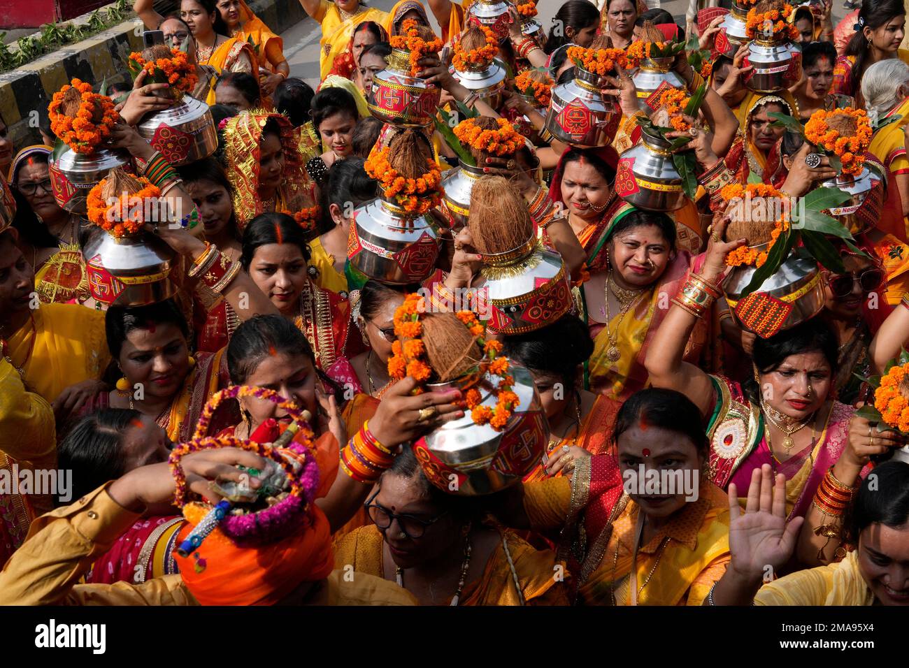 Hindu women carry water from River Ganges on their heads and walk in a ...