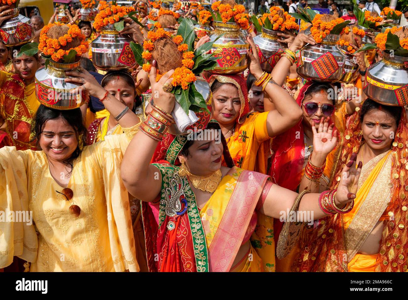 Hindu women carry water from River Ganges on their heads and walk in a ...