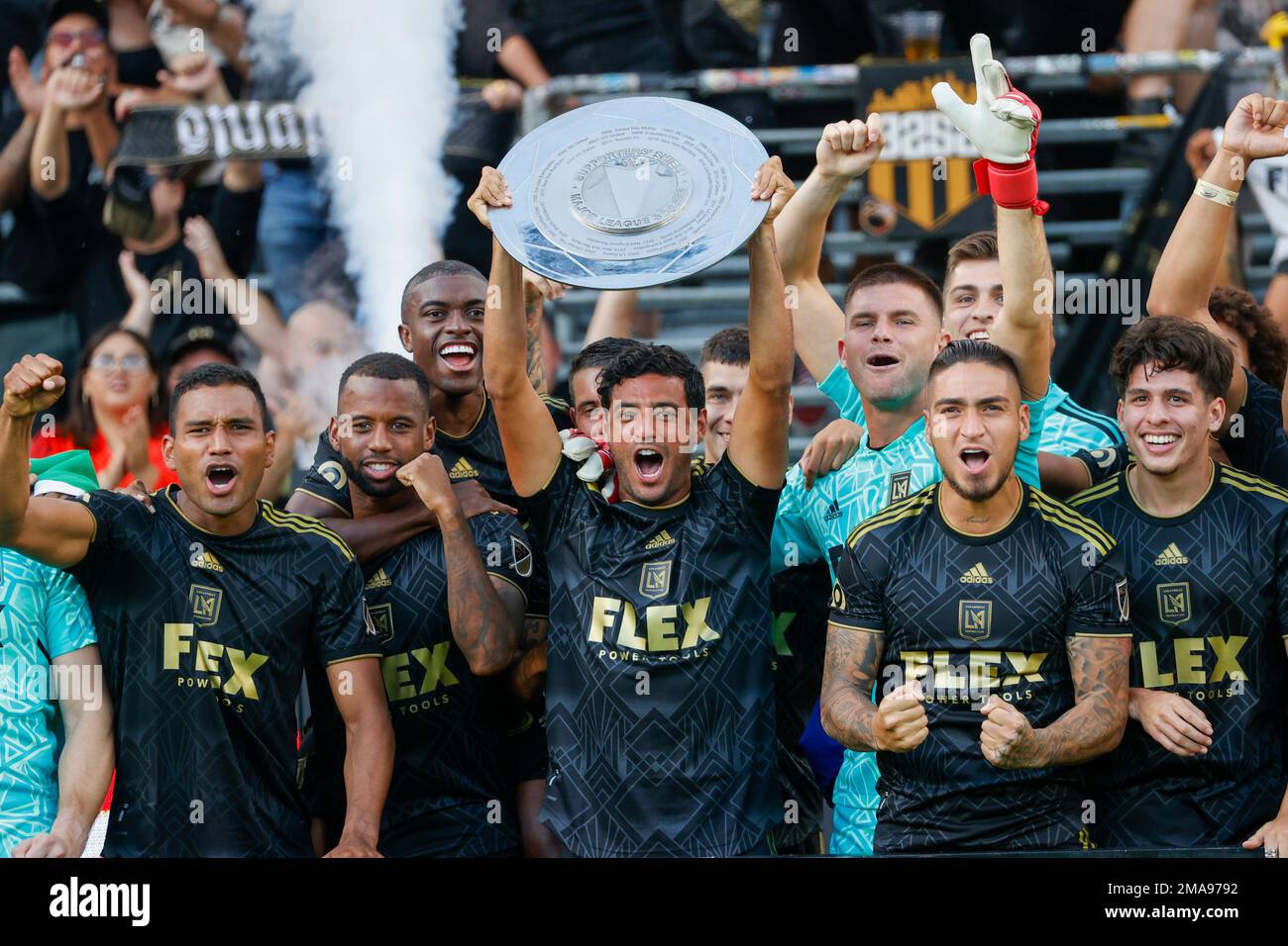 Los Angeles FC forward Carlos Vela, center, holds up the
