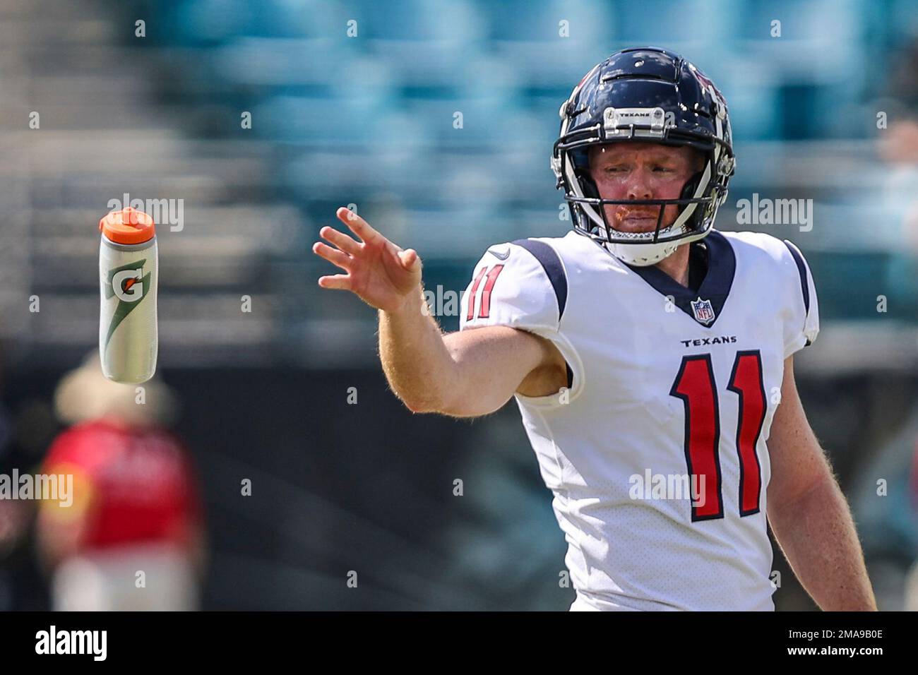 Houston Texans punter Cameron Johnston (11) tosses a bottle during warm-ups  before an NFL football game against the Jacksonville Jaguars on Sunday, Oct.  9, 2022, in Jacksonville, Fla. (AP Photo/Gary McCullough Stock