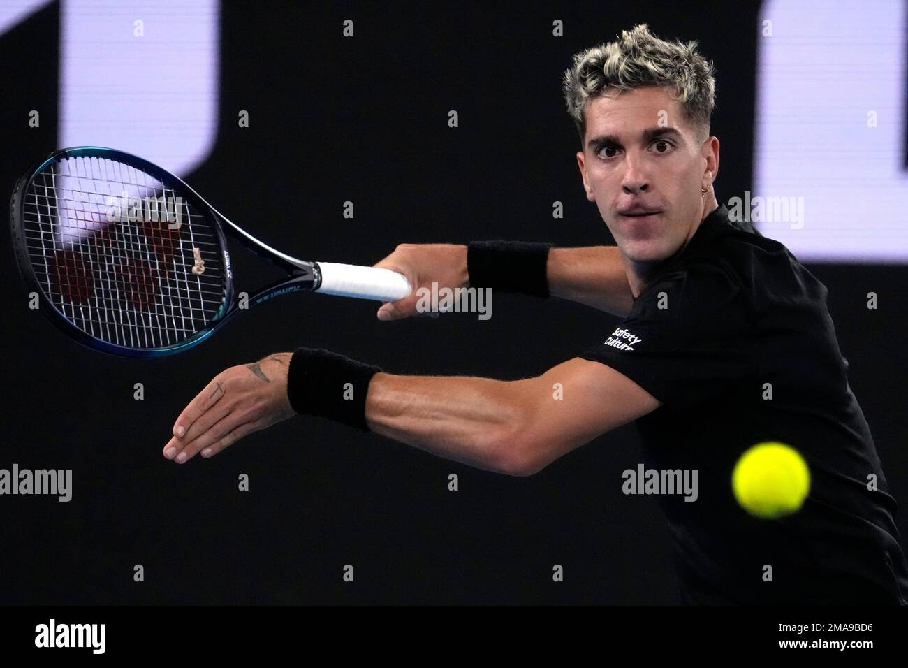 Thanasi Kokkinakis of Australia plays a forehand return to Andy Murray of Britain during their second round match at the Australian Open tennis championship in Melbourne, Australia, Thursday, Jan