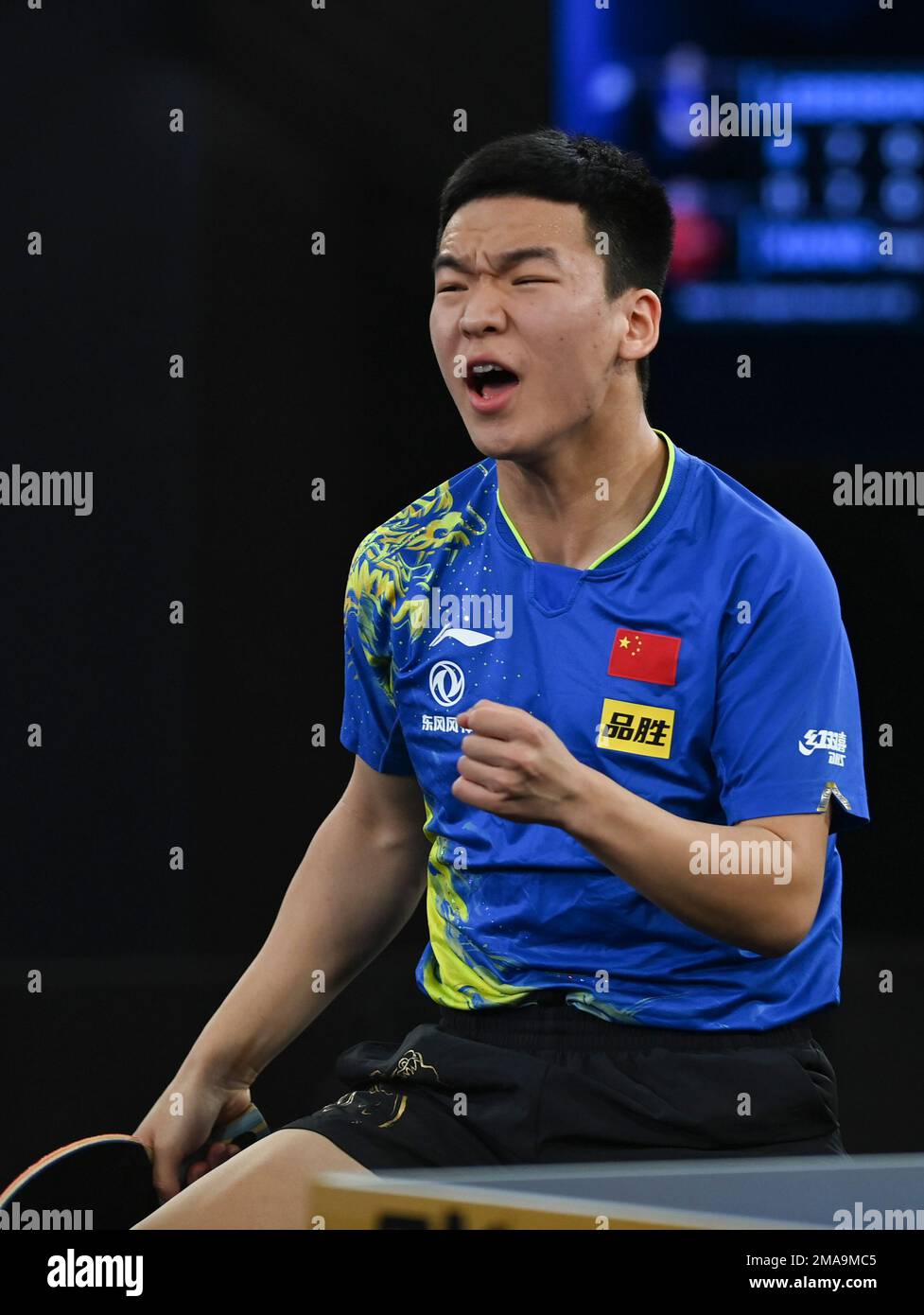 Doha, Qatar. 18th Jan, 2023. Xiang Peng reacts during the men's singles ...