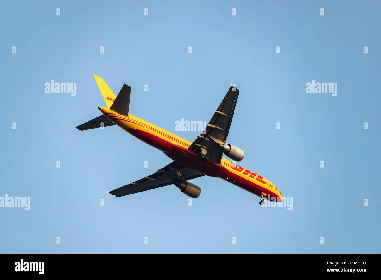 DHL Boeing 757-200F plane flying overhead approaching Lisbon, Portugal. Stock Photo