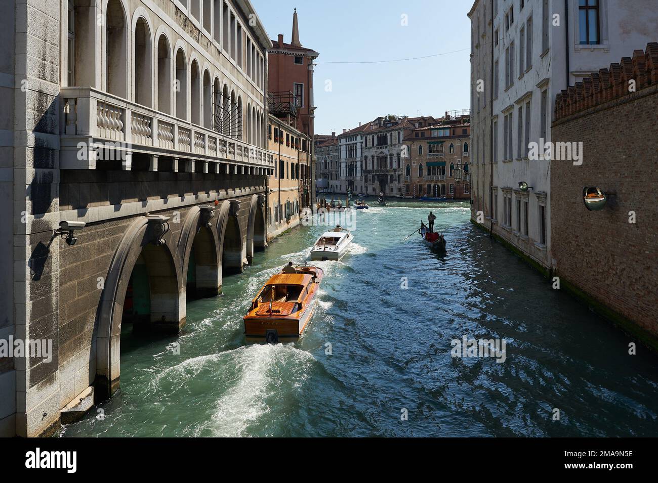 view of the water taxi and gondola over a canal at venice city Stock Photo