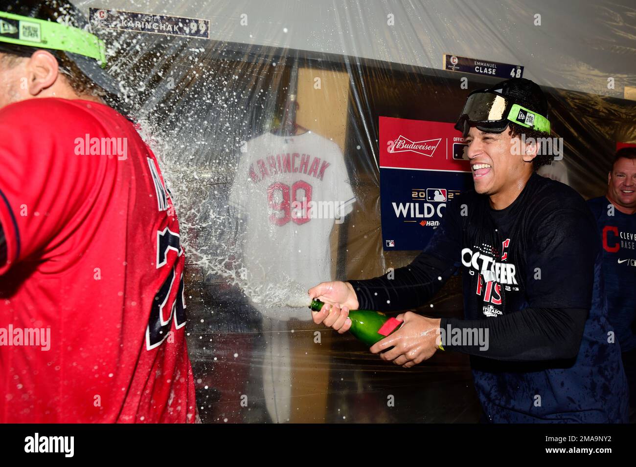 Cleveland Guardians' Josh Naylor, left, and Bo Naylor, right, celebrate in  the locker room after defeating the Tampa Bay Rays in the wild card  baseball playoff, Saturday, Oct. 8, 2022, in Cleveland. (