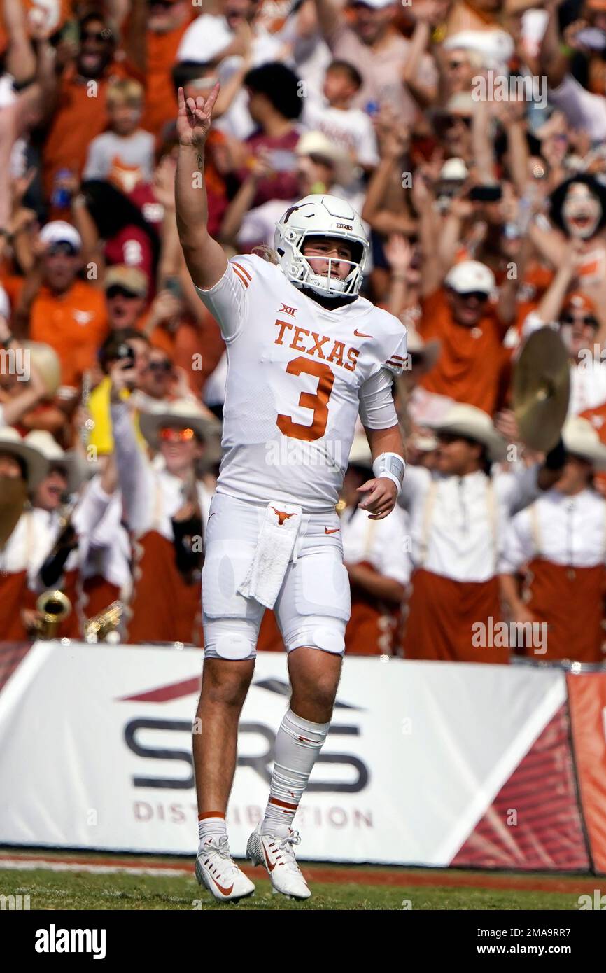 Texas quarterback Quinn Ewers celebrates throwing a touchdown pass