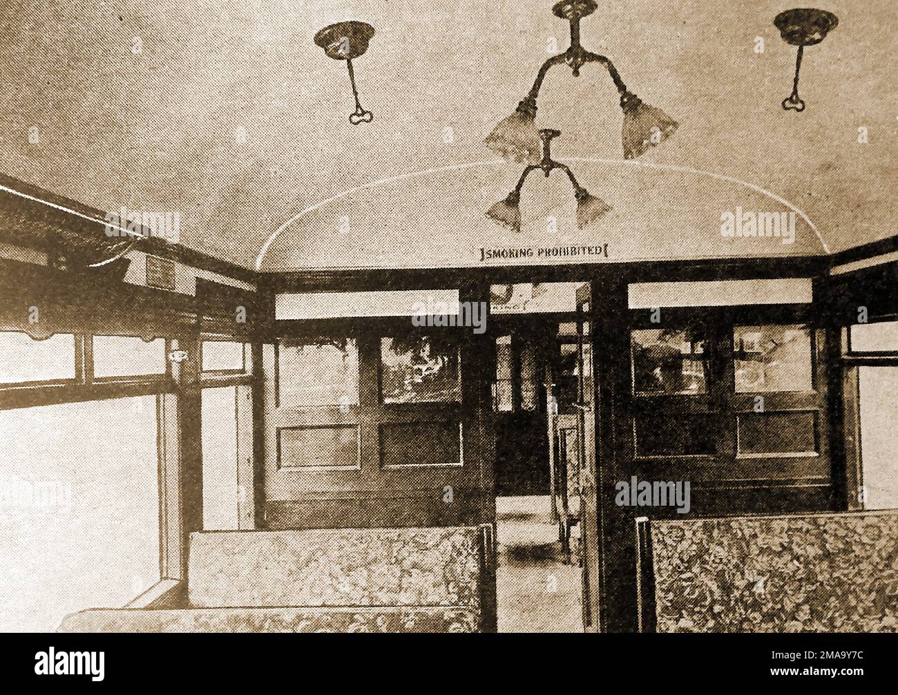 A 1930 photo of the interior of one of the newly introduced electric train's carriages. Stock Photo