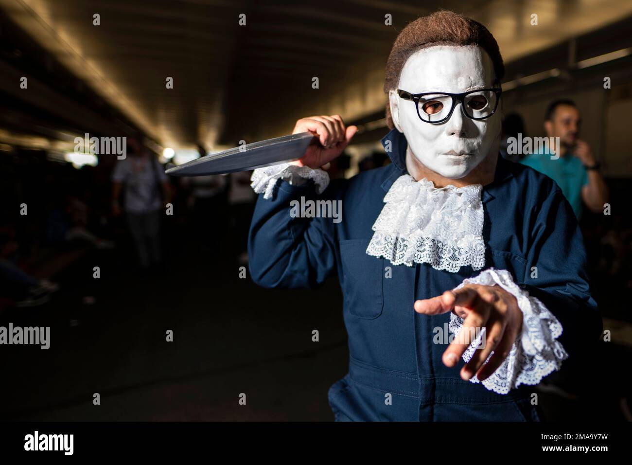 An attendee dressed as a cross between Michael Myers from "Halloween