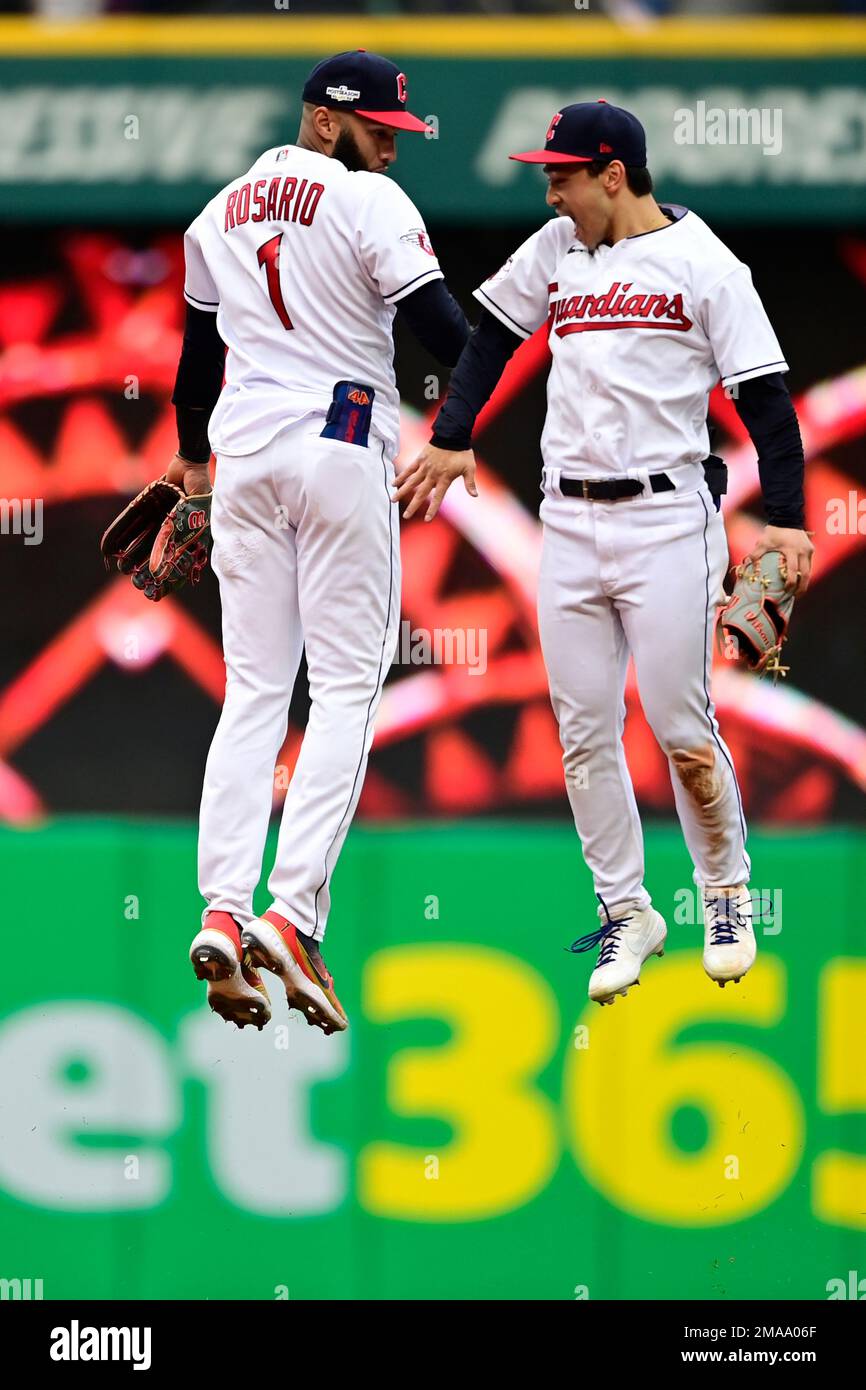 Cleveland Guardians' Amed Rosario (1) and Steven Kwan, right, celebrate  after defeating the Tampa Bay Rays in a wild card baseball playoff game,  Friday, Oct. 7, 2022, in Cleveland. (AP Photo/David Dermer