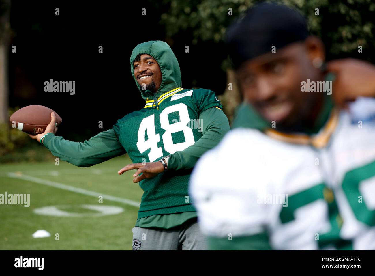 Green Bay Packers linebacker DQ Thomas takes part in a flag