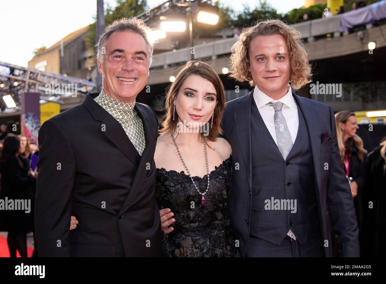 Greg Wise, Gaia Wise and Basil Eidenbenz pose for photographers upon