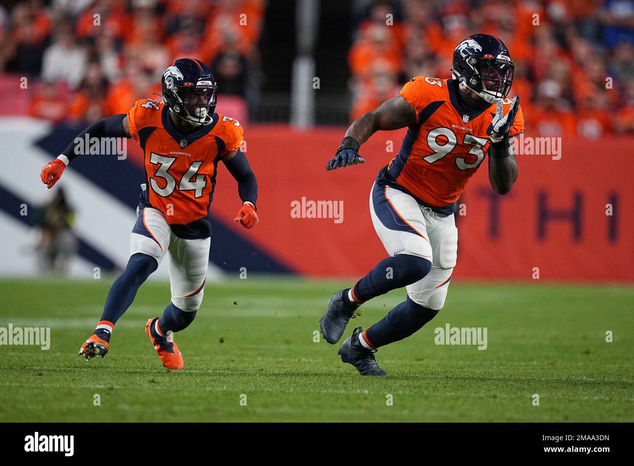 Denver Broncos cornerback Essang Bassey (34) and Denver Broncos