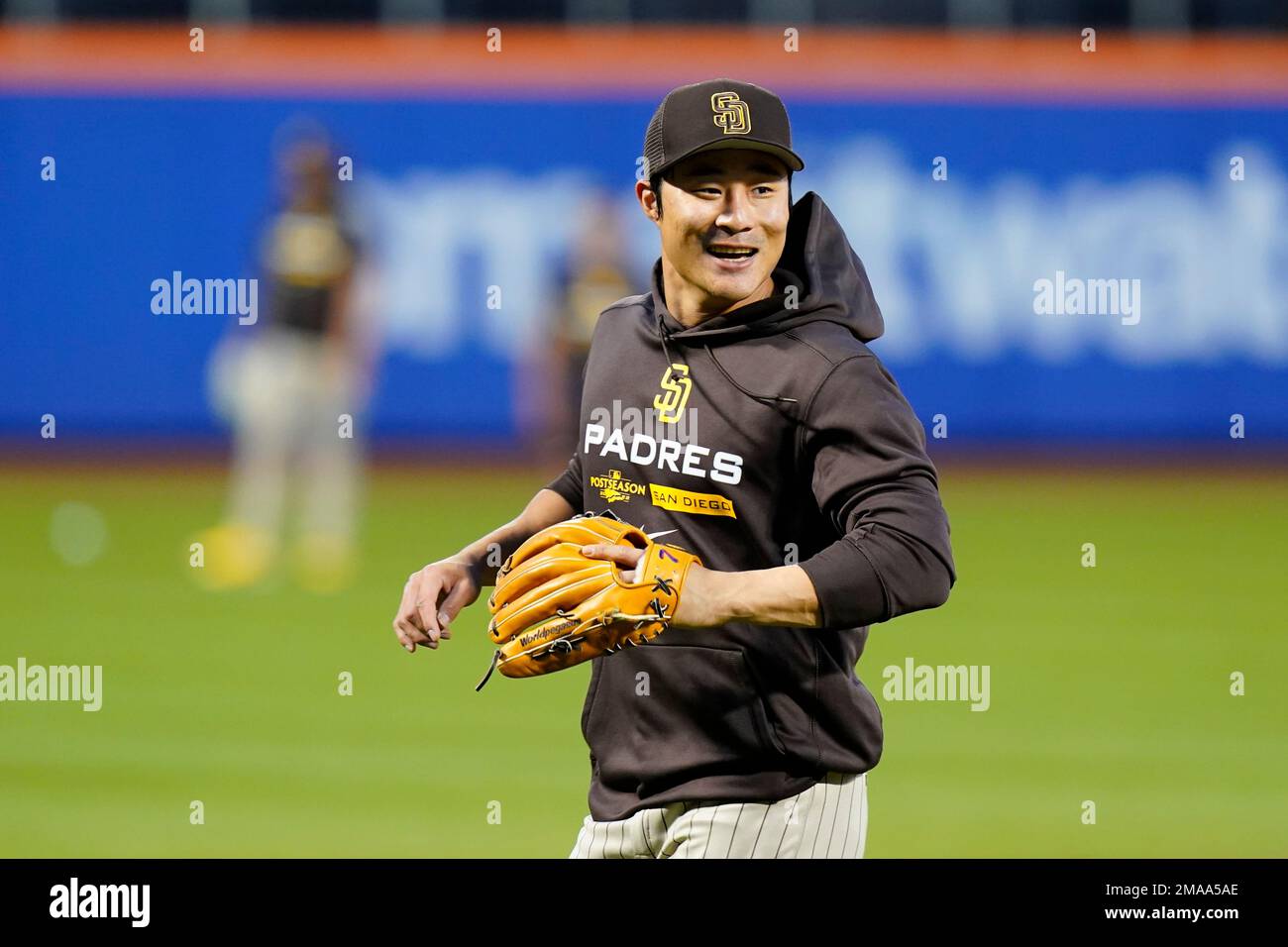 San Diego Padres' Ha-Seong Kim, of South Korea, smiles while taking part in  drills the day before a wild-card baseball playoff game against the New  York Mets, Thursday, Oct. 6, 2022, in