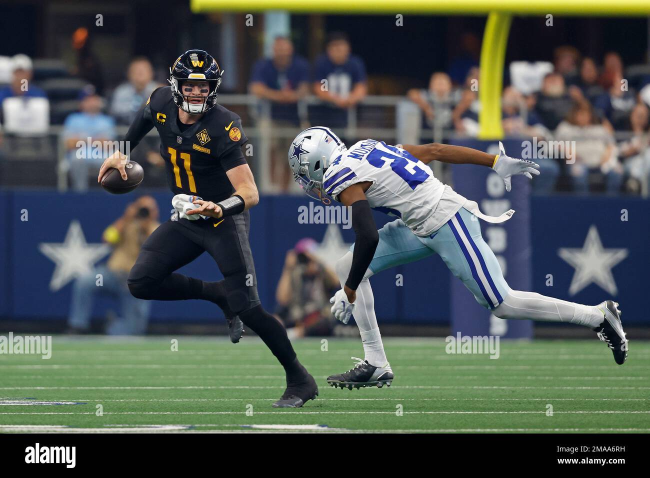 Washington Commanders quarterback Carson Wentz (11) runs the ball during an  NFL football game against the Dallas Cowboys, Sunday, Oct. 2, 2022, in  Arlington. (AP Photo/Tyler Kaufman Stock Photo - Alamy