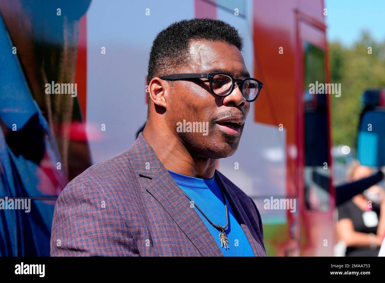 GOP Senate nominee Herschel Walker smiles during remarks during