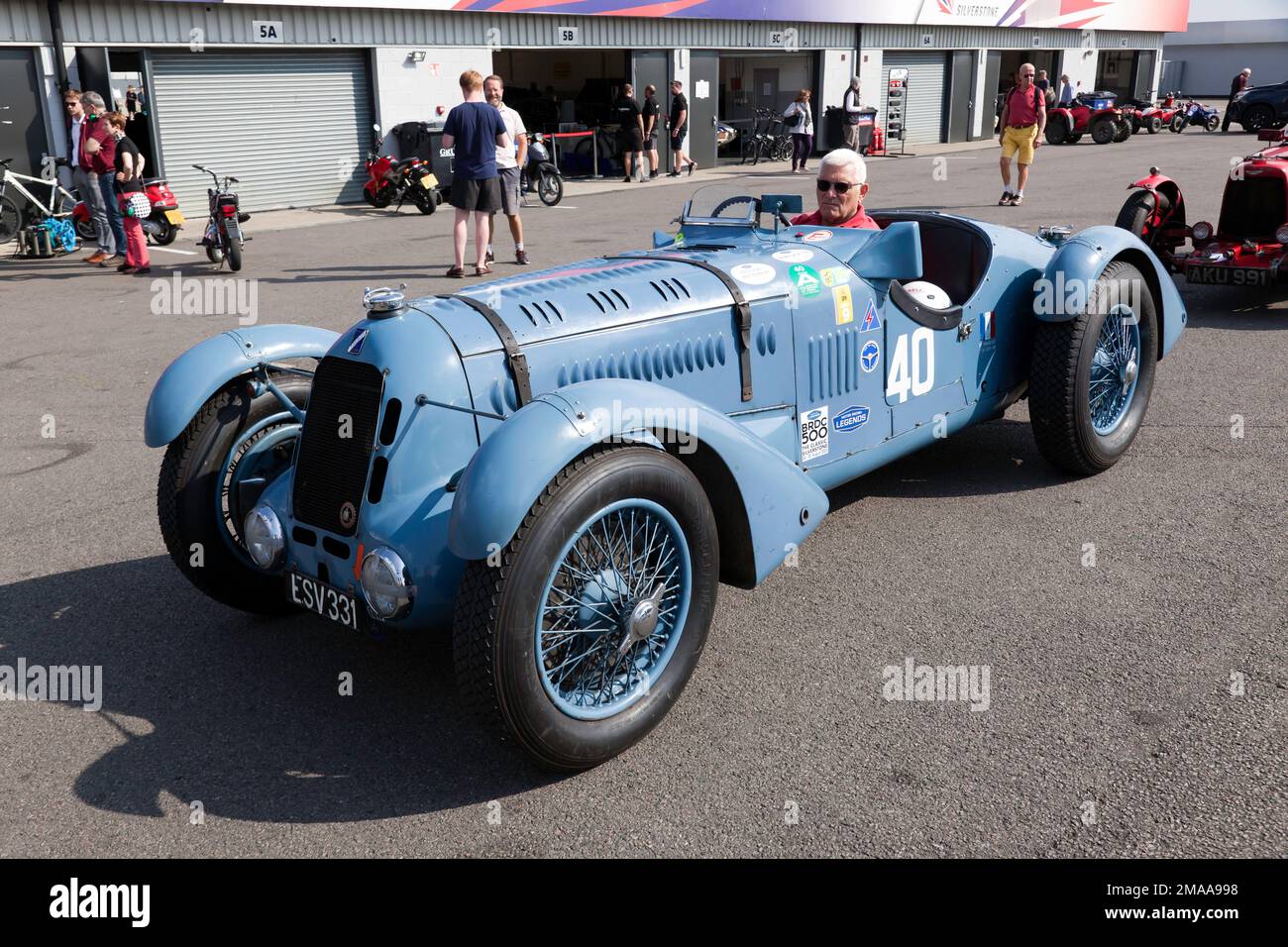 Till Bechtolsheimer driving his Blue, 1936, Talbot Lago T150C, across  the National  Paddock, during the 2022 Silverstone Classic Stock Photo