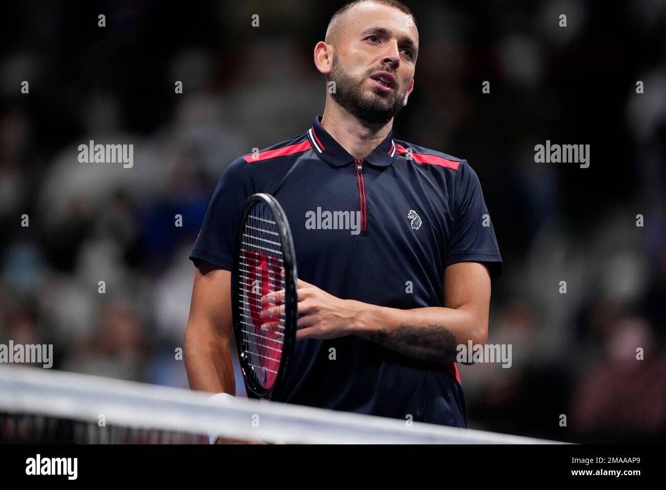 Daniel Evans of Britain reacts after losing a point against Miomir Kecmanovic of Serbia in the Rakuten Open tennis tournament in Tokyo, Thursday, Oct