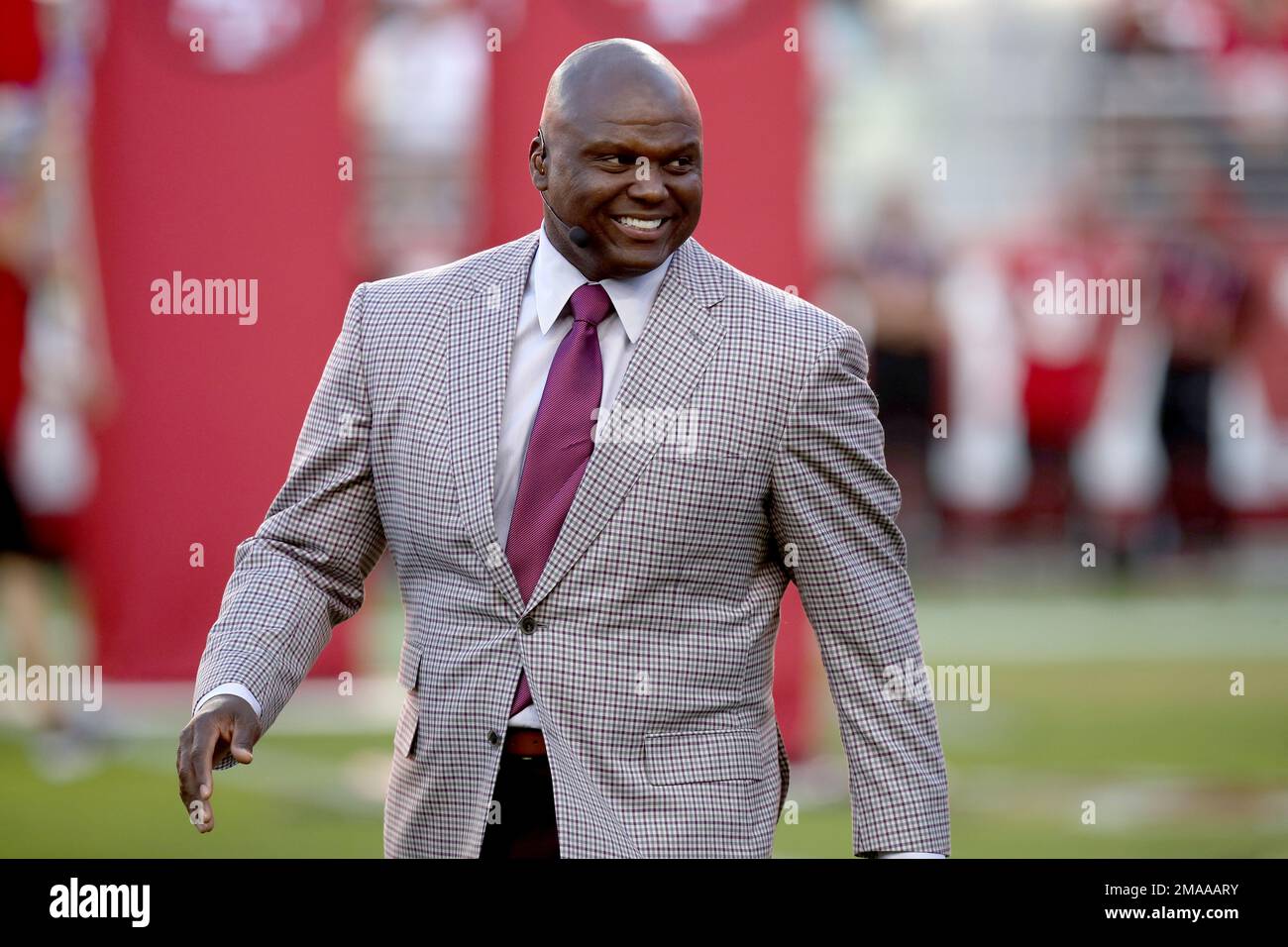 TV Analyst Booger McFarland reacts before an NFL football game between