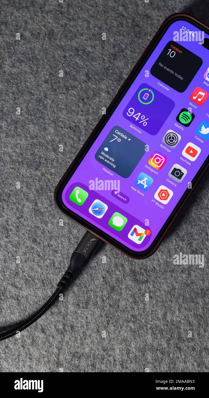 LONDON JANUARY 10, 2023 Apple iPhone 14 Pro charging cable with home