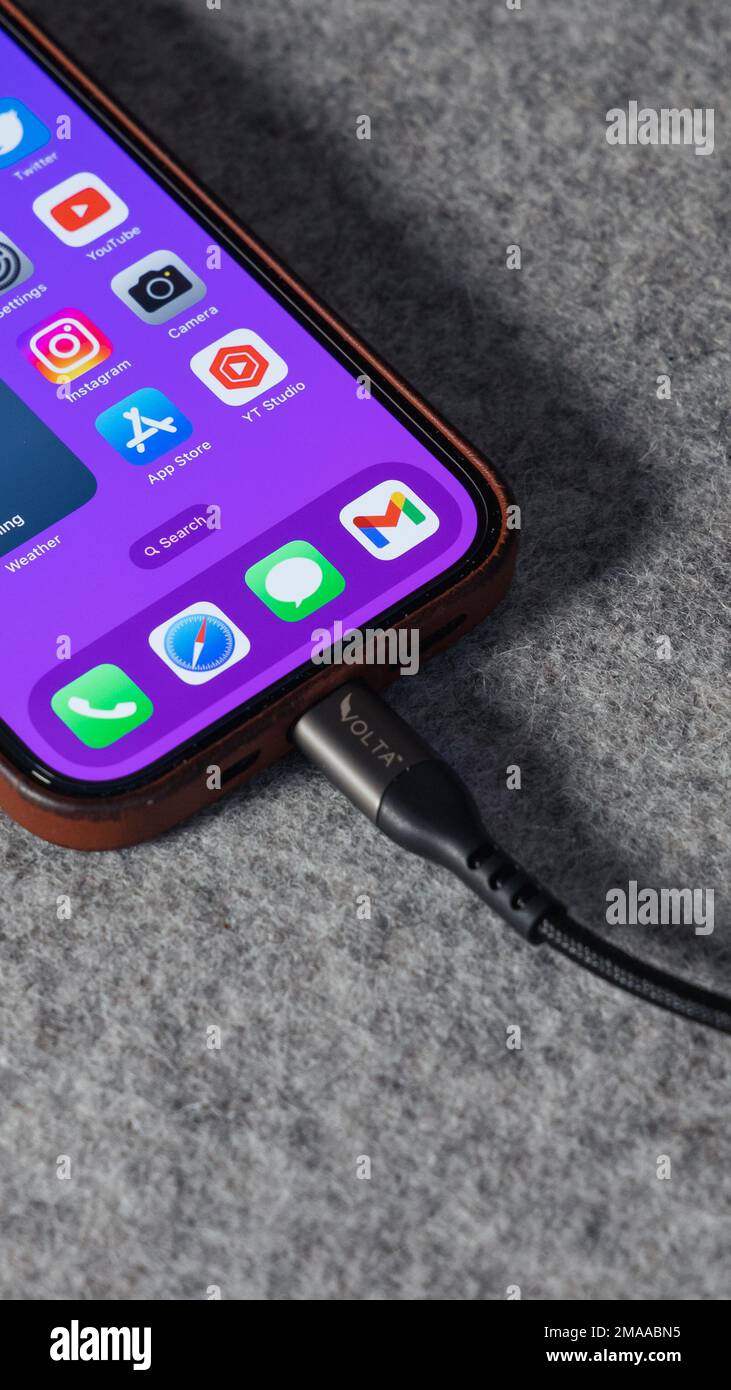 LONDON JANUARY 10, 2023 Apple iPhone 14 Pro charging cable with home