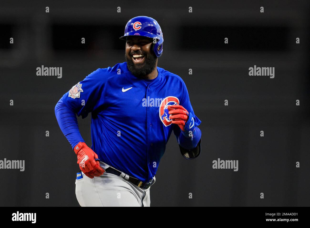 Chicago Cubs' Franmil Reyes laughs as he runs the bases after hitting a  two-run home run during the eighth inning of the team's baseball game  against the Cincinnati Reds in Cincinnati, Wednesday