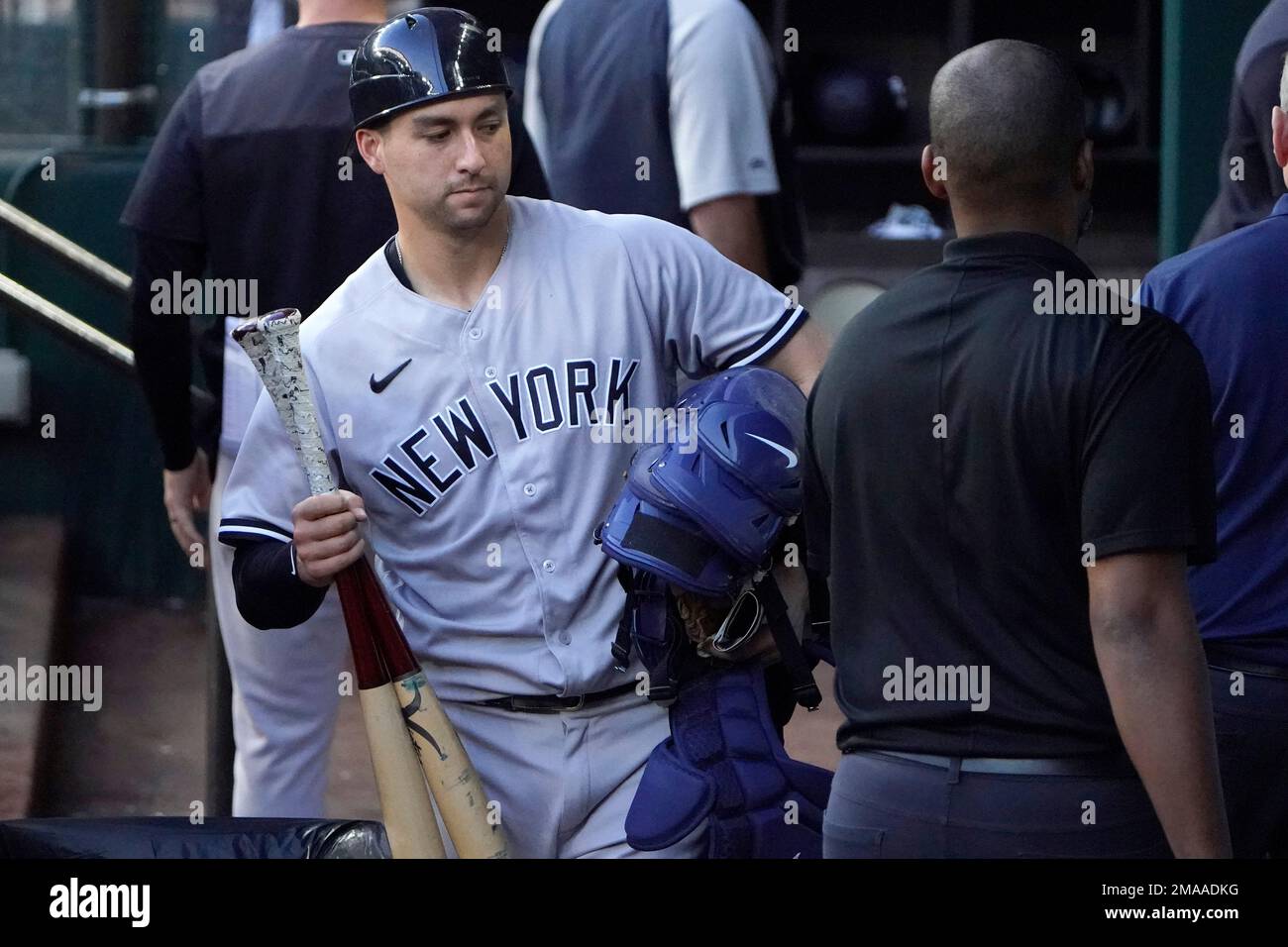 New York Yankees catcher Kyle Higashioka gathers his gear in the dugout  after a 4-2 loss of a baseball game against the Texas Rangers in Arlington,  Texas, Wednesday, Oct. 5, 2022. (AP