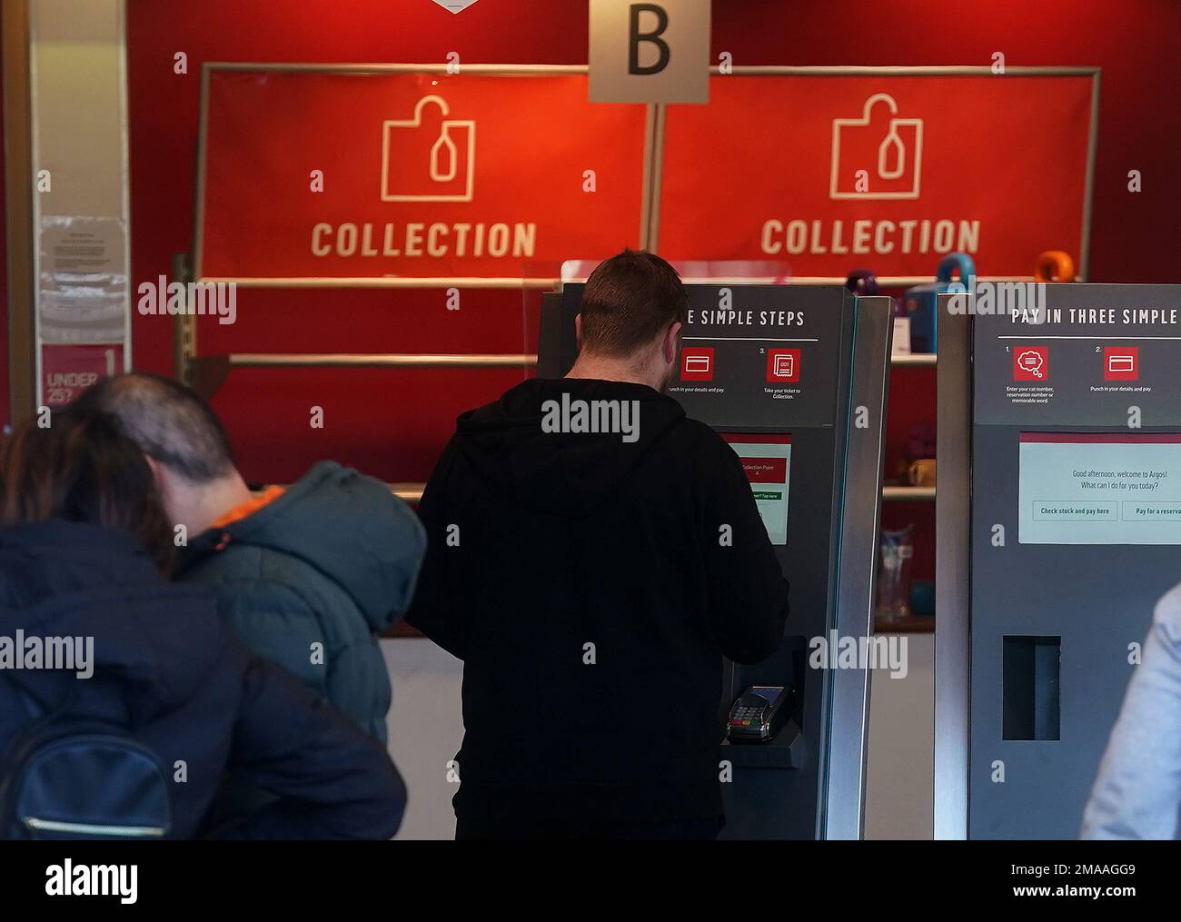 People use self service kiosk in an Argos store in Santry, Dublin