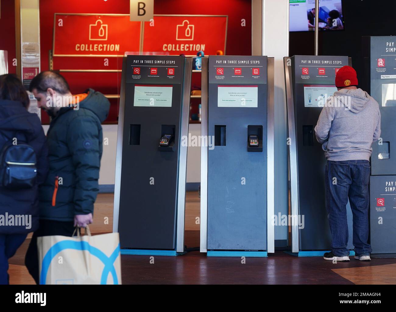 People use self service kiosk in an Argos store in Santry, Dublin