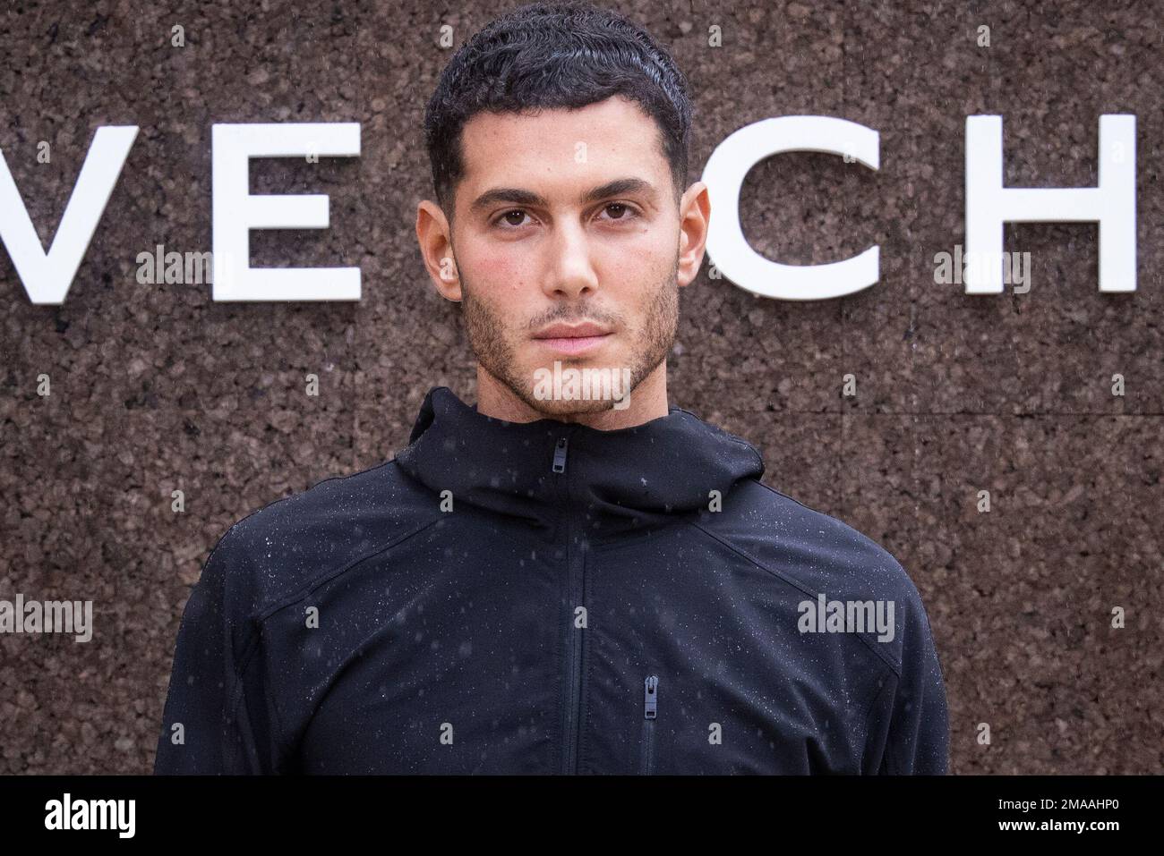 Fai Khadra poses for photographers upon arrival for the Givenchy ready