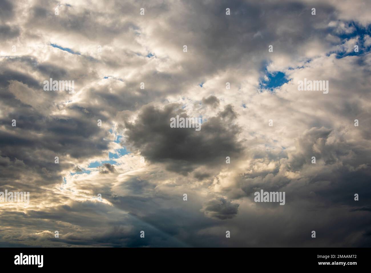 Sun rays through storm clouds hi-res stock photography and images - Alamy