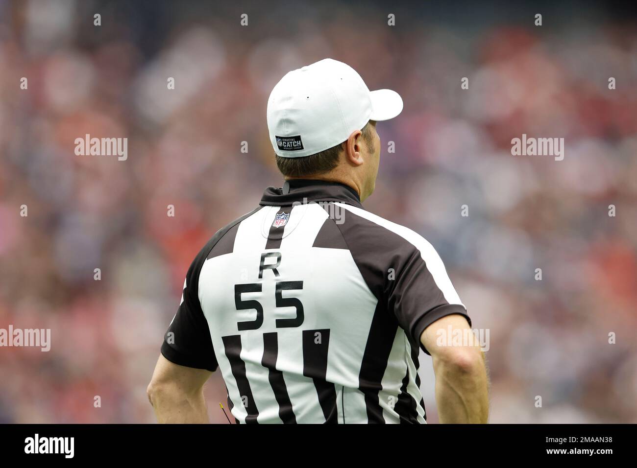 NFL official, referee Alex Kemp (55) wearing a crucial catch patch on