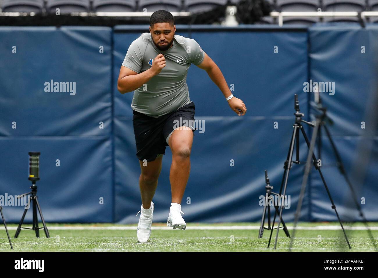 Offensive lineman Jack Akiono, of New Zealand, runs the 40yard dash at the NFL international