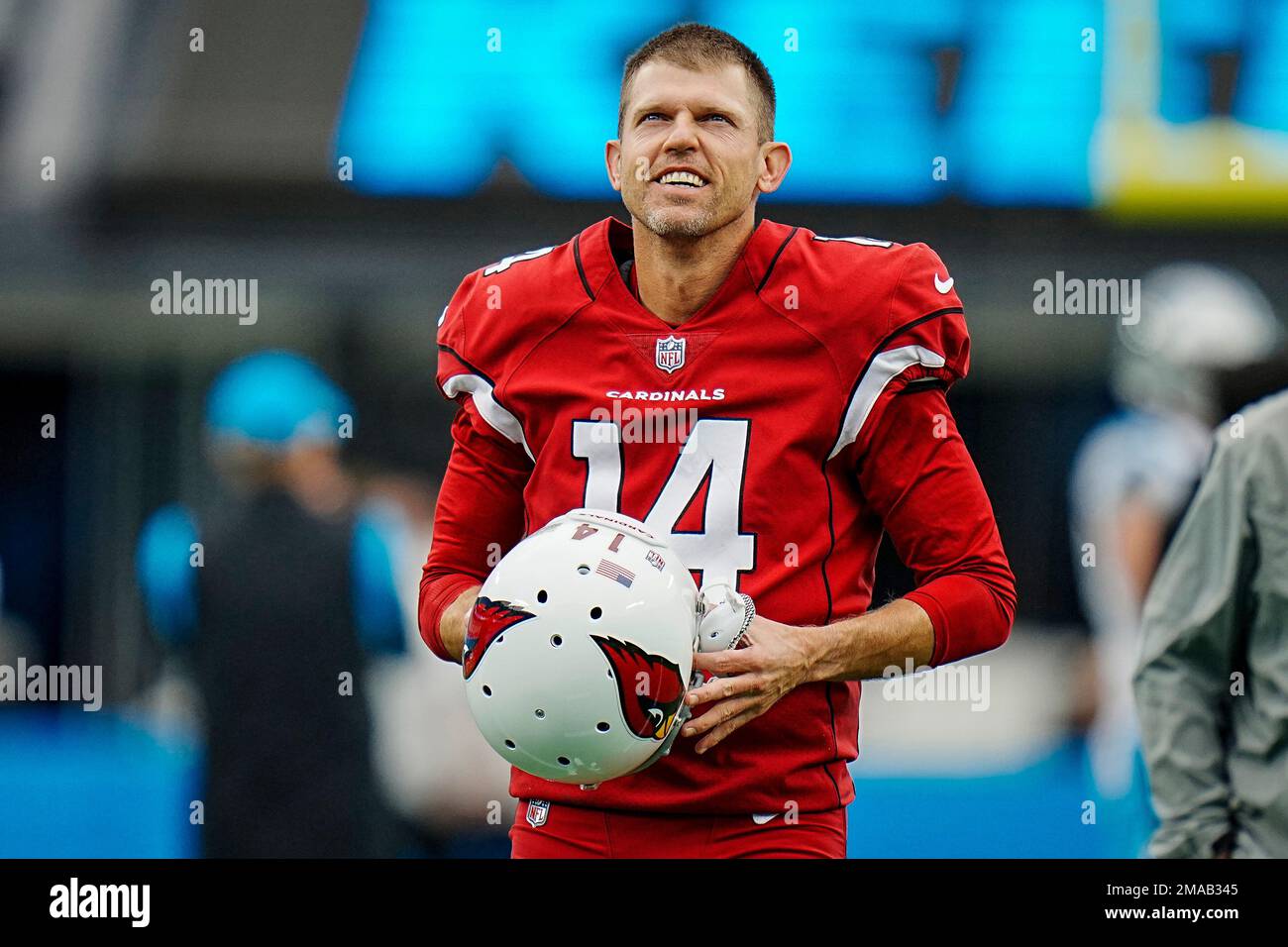 Arizona Cardinals punter Andy Lee (14) looks at the clock prior to the  start of an NFL football game against the Carolina Panthers on Sunday, Oct.  02, 2022, in Charlotte, . (AP