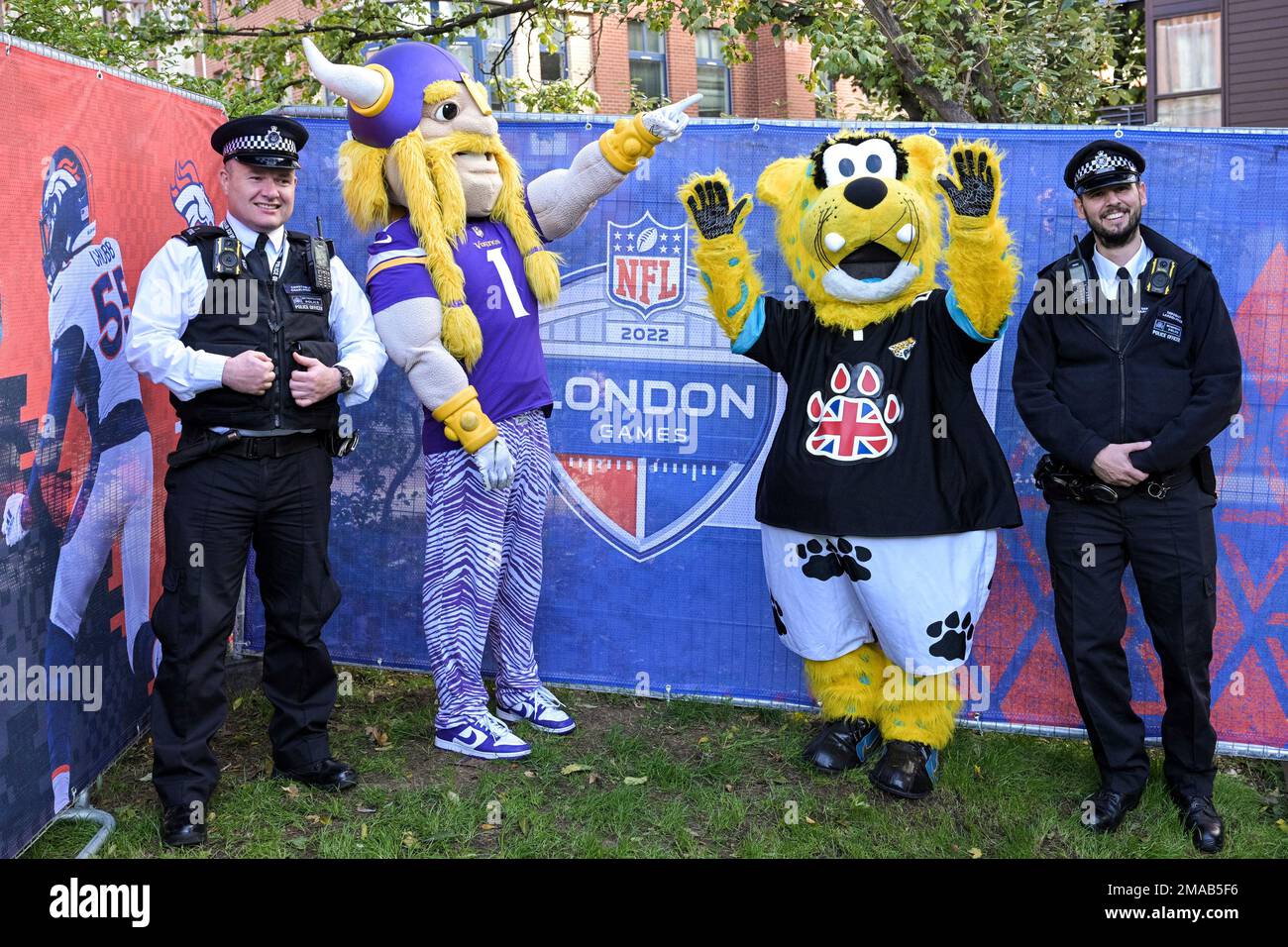 Metropolitan Police officers pose for photos with NFL Mascots during the  Fan event on the Southbank of the River Thames with activities and an NFL  shop on Saturday, Oct. 01 2022 in