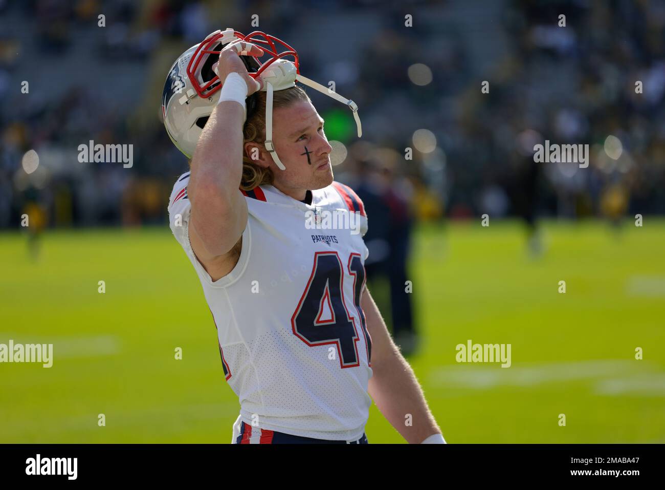 New England Patriots safety Brenden Schooler looks up to the scoreboard  before an NFL football game against the Green Bay Packers Sunday, Oct. 2,  2022, in Green Bay, Wis. (AP Photo/Matt Ludtke