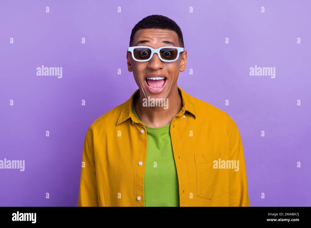 Portrait of ecstatic overjoyed handsome guy wear yellow clothes glasses