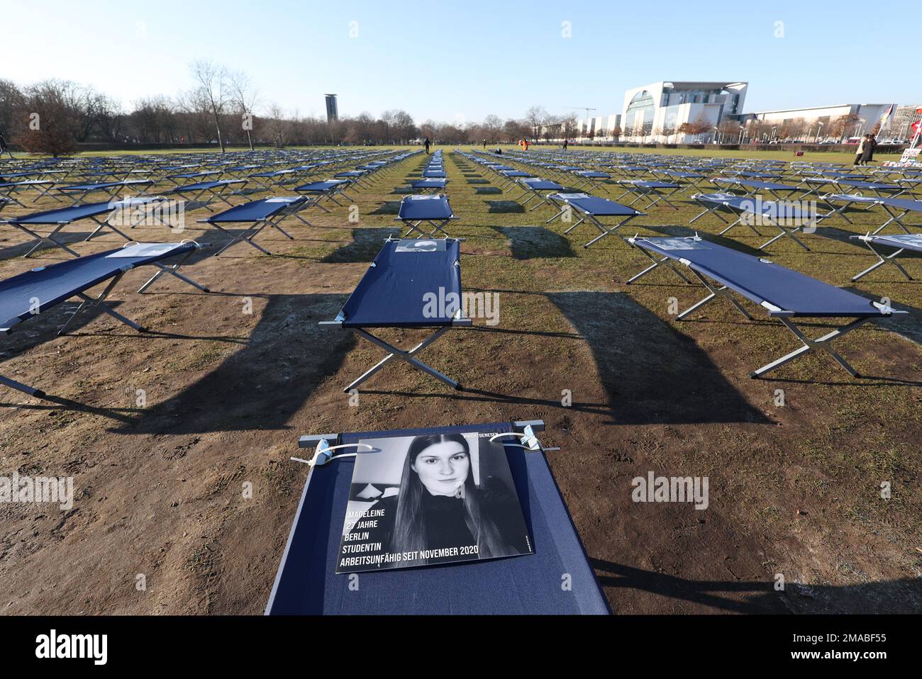 Berlin, Germany. 19th Jan, 2023. During a demonstration by LongCovid and ME/CFS sufferers, 400 camp beds with portraits of sufferers from all over Germany have been set up in front of the Reichstag building. Credit: Joerg Carstensen/dpa/Alamy Live News Stock Photo