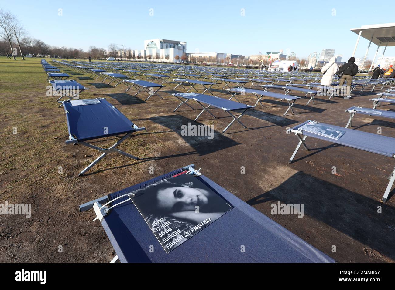 Berlin, Germany. 19th Jan, 2023. During a demonstration by LongCovid and ME/CFS sufferers, 400 camp beds with portraits of sufferers from all over Germany have been set up in front of the Reichstag building. Credit: Joerg Carstensen/dpa/Alamy Live News Stock Photo