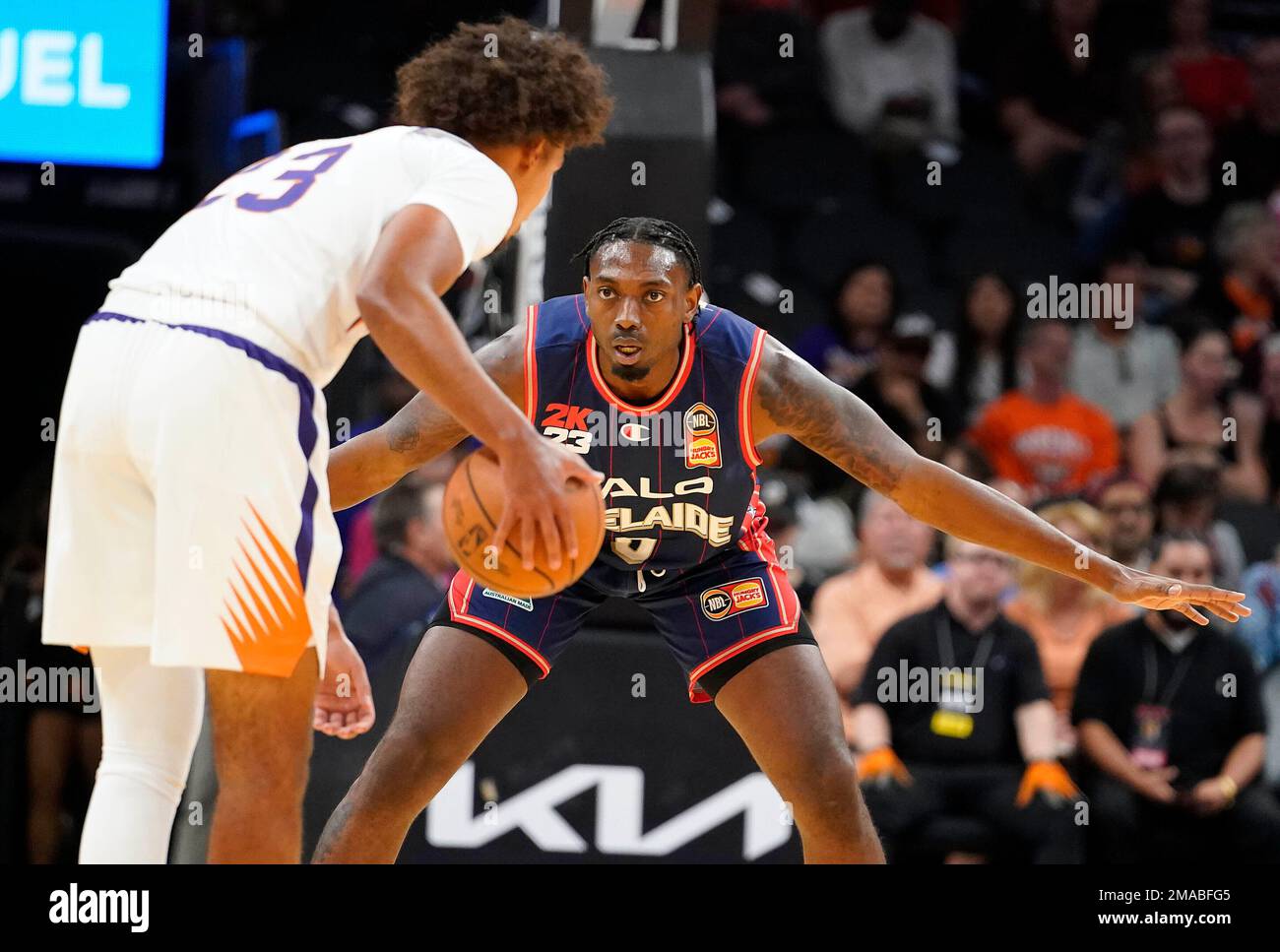 Adelaide 36ers' Robert Franks guards Phoenix Suns' Cam Johnson during ...