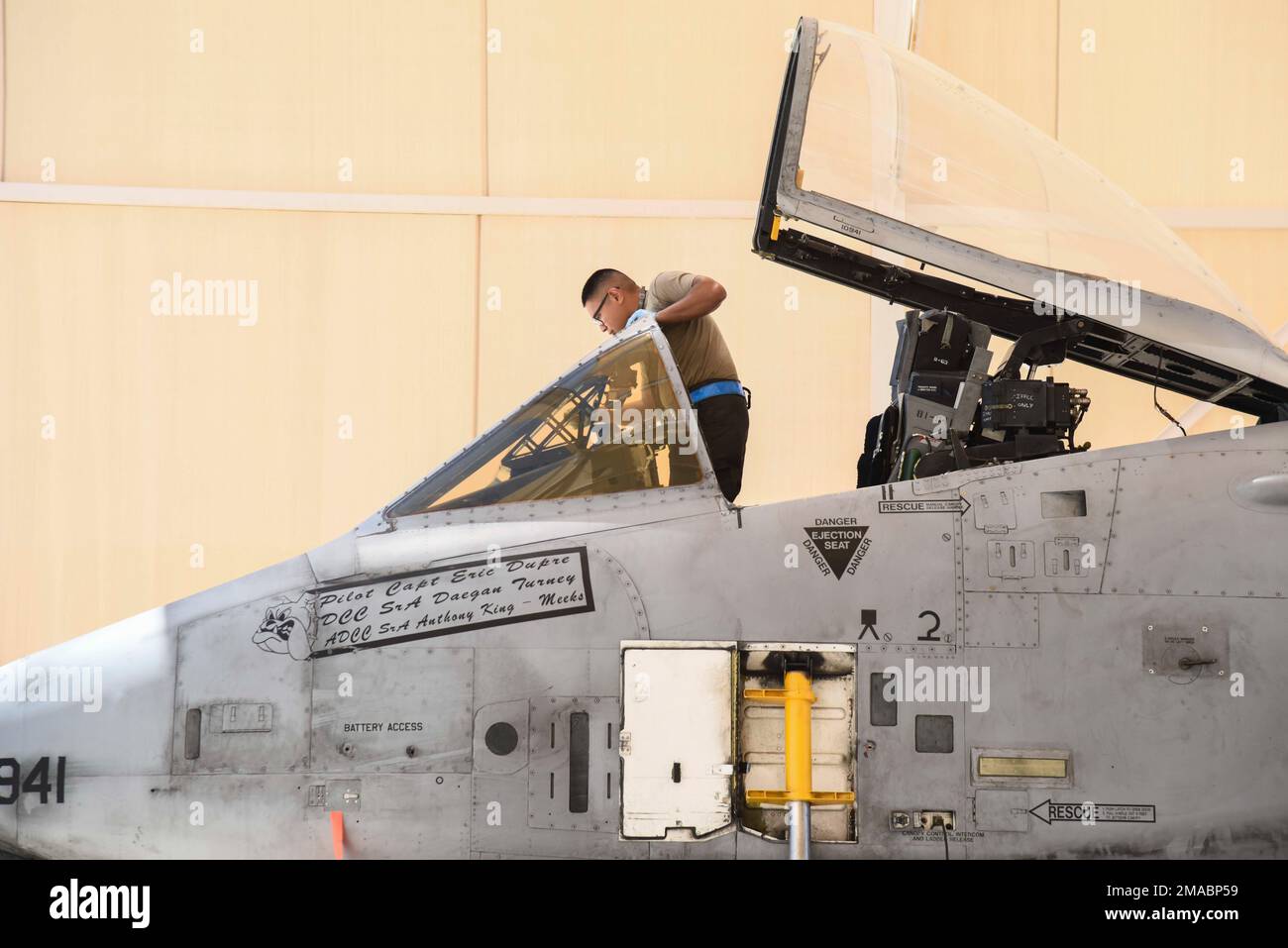 A U.S. Airman assigned to the 354th Fighter Generation Squadron cleans ...