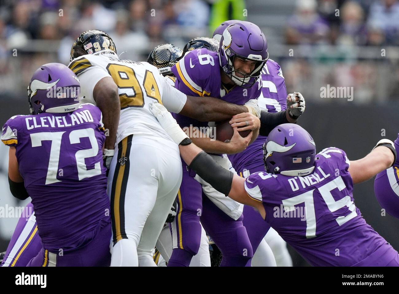 Minnesota Vikings quarterback Kirk Cousins (8), centre, is sacked during an  NFL match between Minnesota Vikings and New Orleans Saints at the Tottenham  Hotspur stadium in London, Sunday, Oct. 2, 2022. (AP