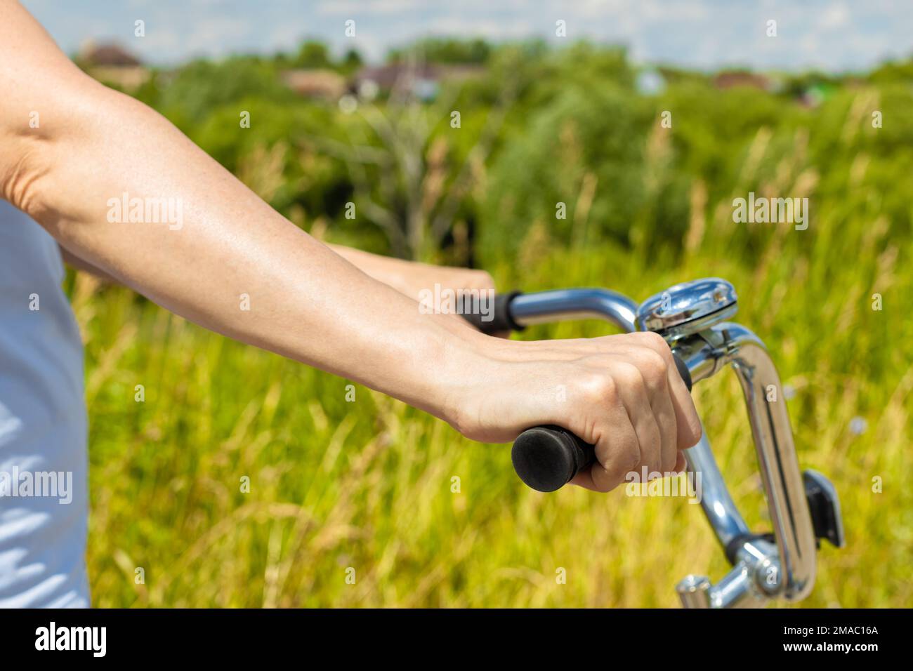 man rides a bike in nature in summer. woman cycling in summer Stock Photo
